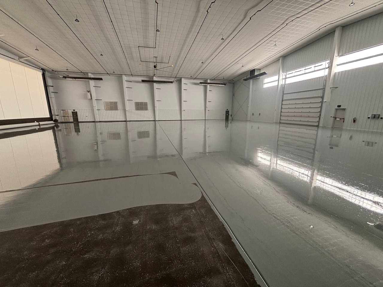 Industrial hangar floor coating installation at Perkins Hangar, Wright-Patterson Air Force Base